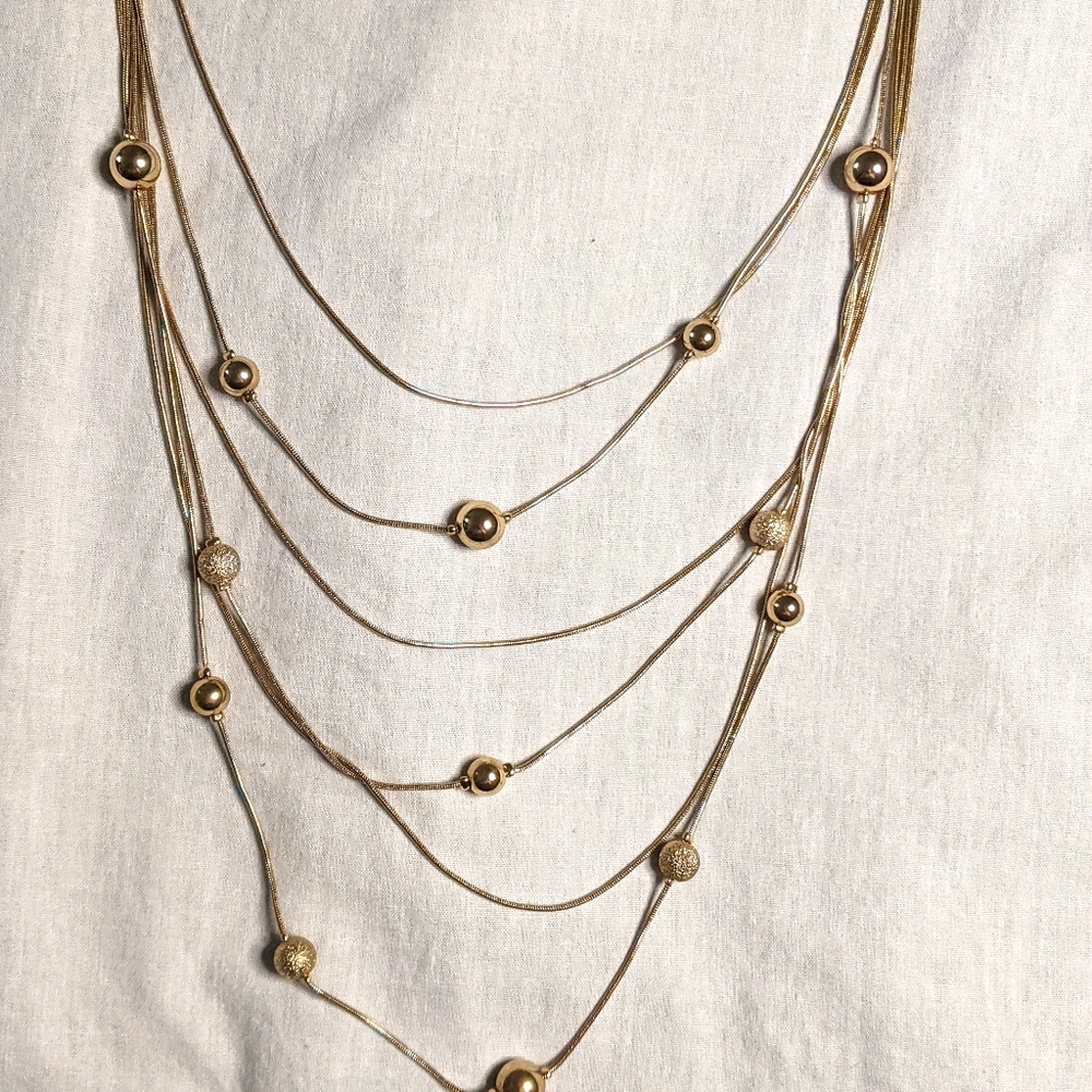 Multi stran gold necklace